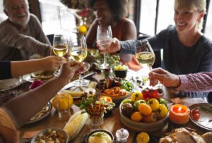 People drinking wine at Thanksgiving