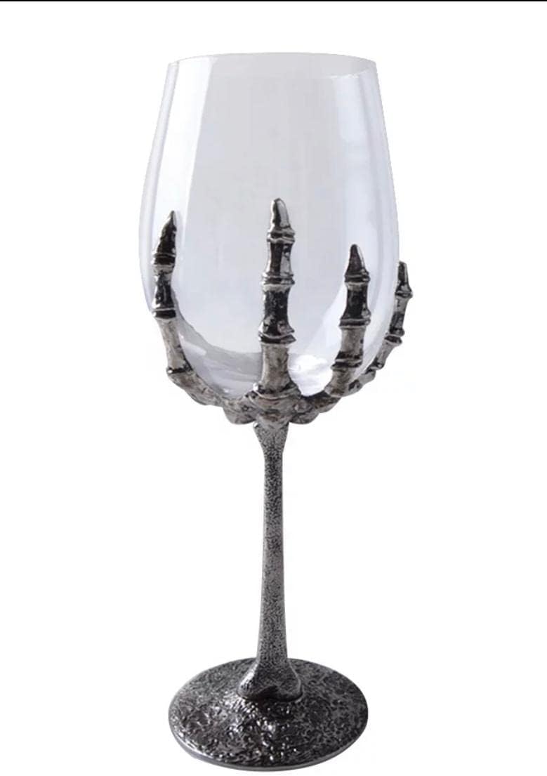 Skeleton hand holding wine glass
