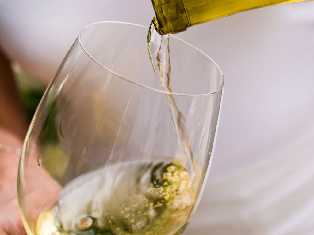 Dry Chardonnay being poured into a glass