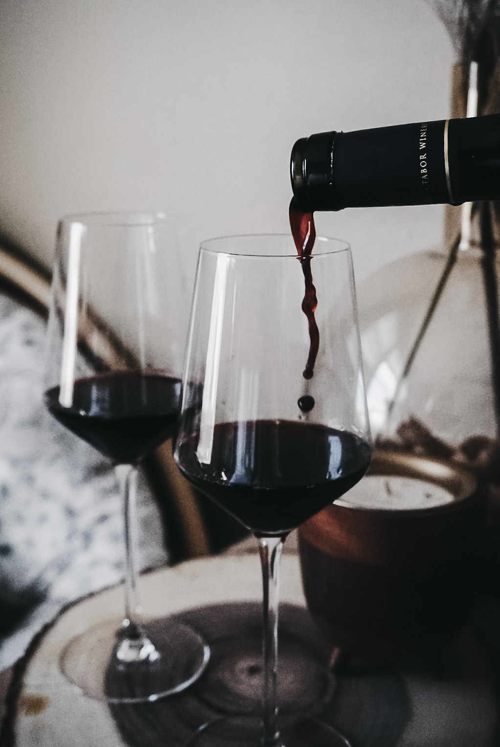 Merlot being poured into a glass