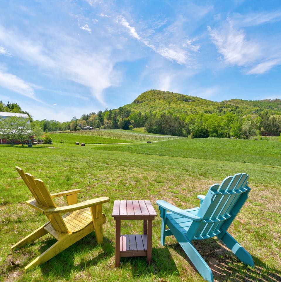 Two lawn chairs by scenic overlook