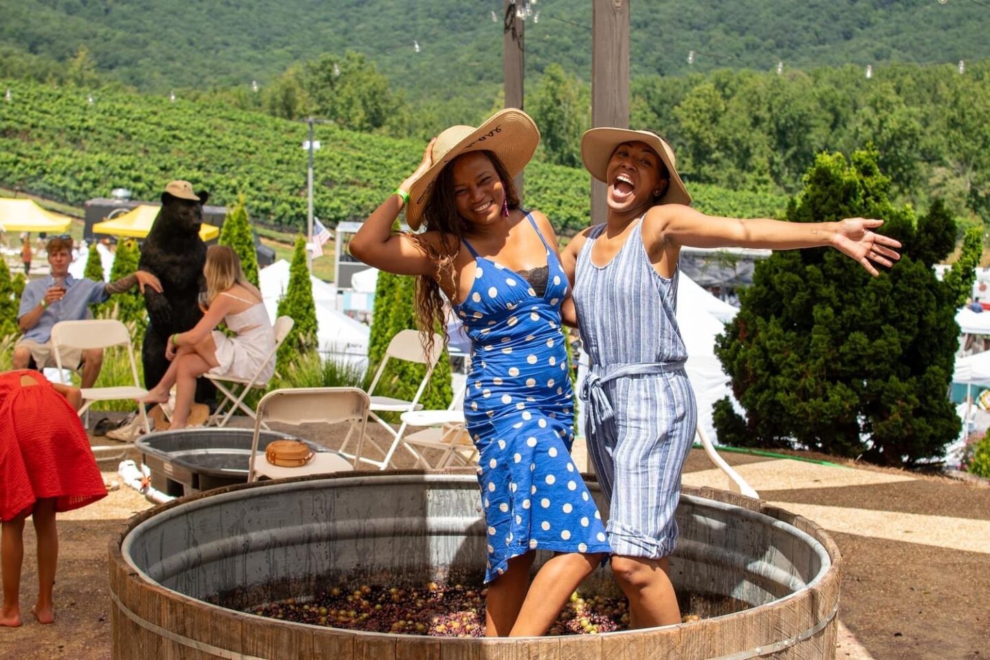 Two women stomp grapes at Yonah Mountain in GA