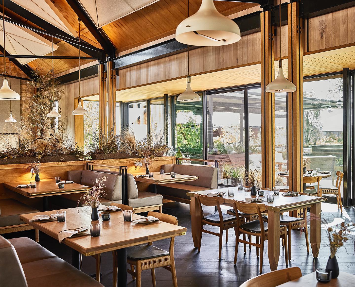 Interior shot of a restaurant with large, folding windows