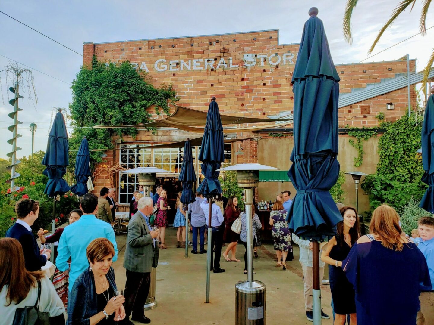 Exterior shot of Napa General Store and customers enjoying the outdoor patio