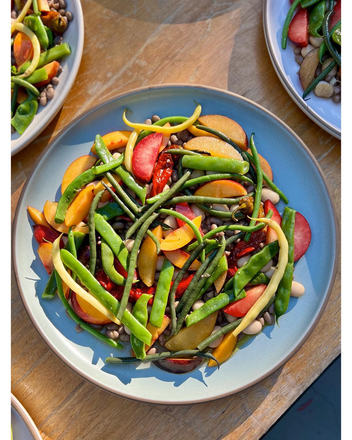 A plate of summer peaches and green beans
