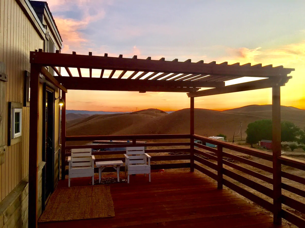 Views of a sunset from an outdoor deck