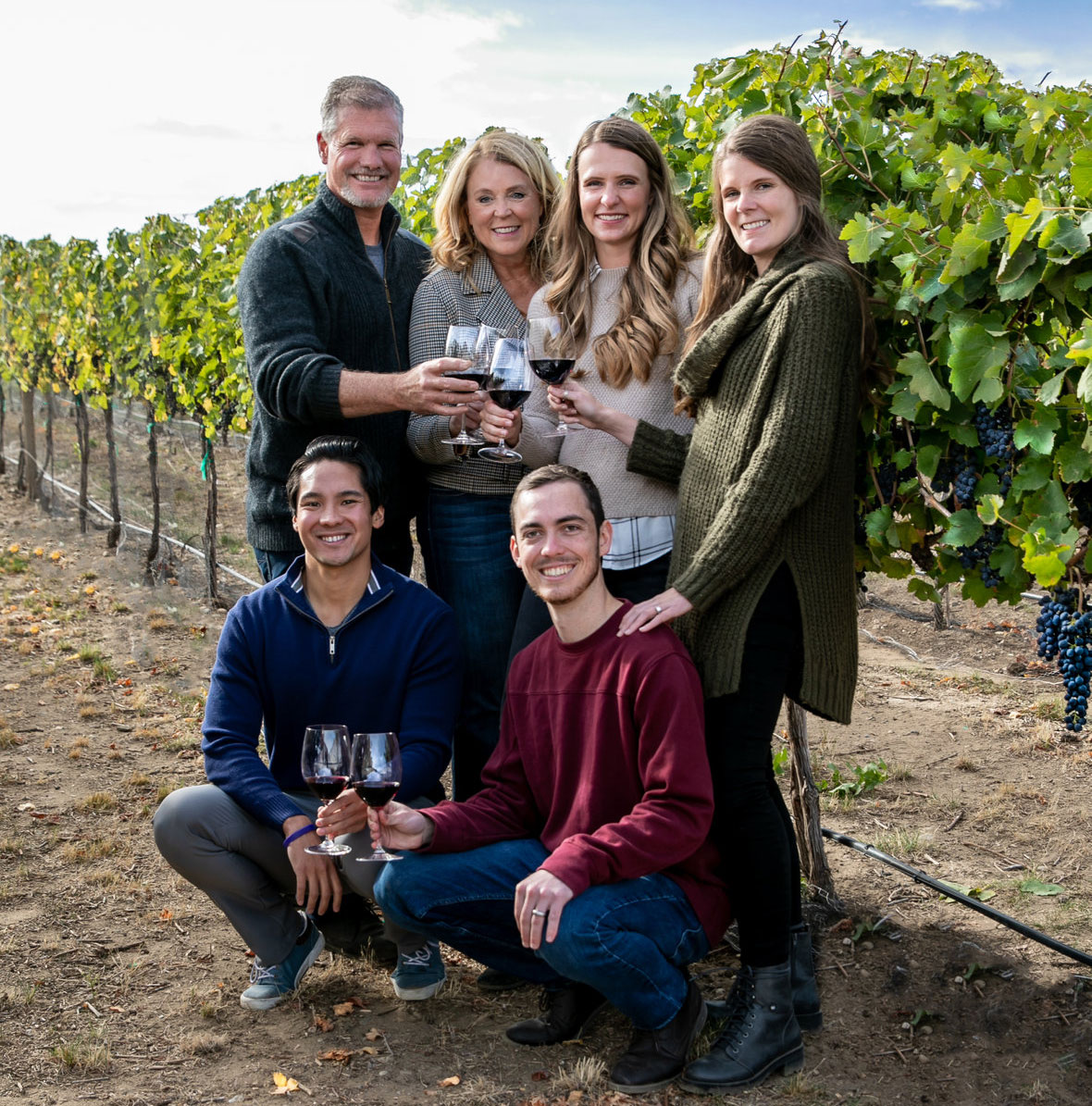 The Dufenhorst Family, Proprietors of Rocky Pond in a vineyard