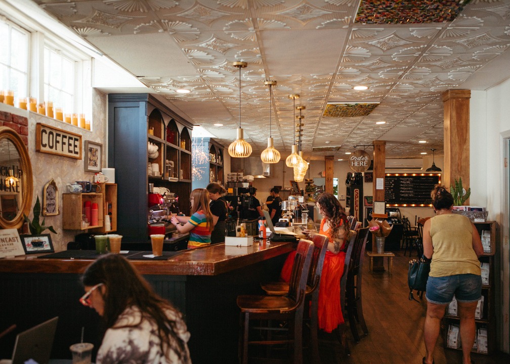 people working in a cafe