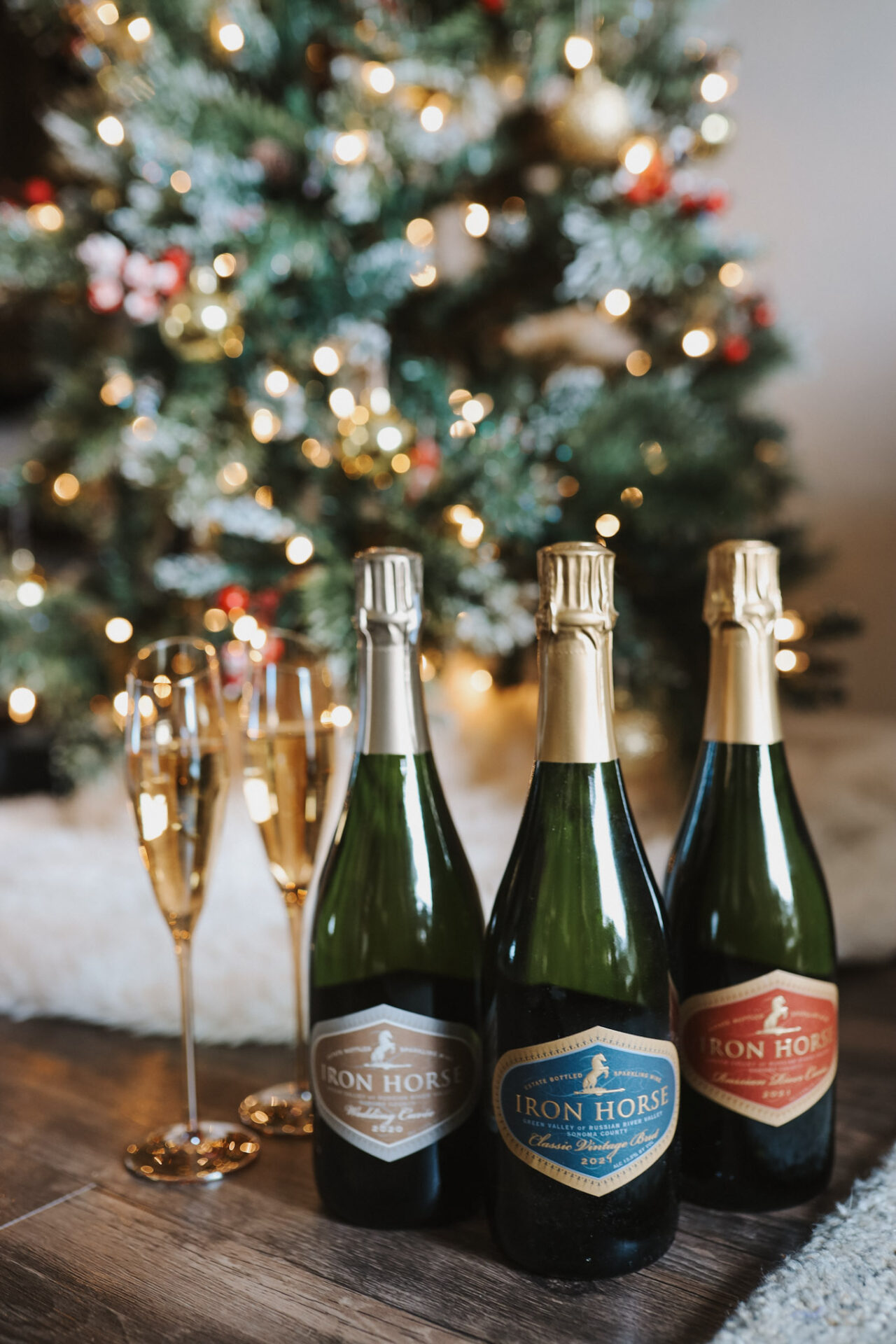 Iron Horse Vineyards Bubbles in front of Christmas tree