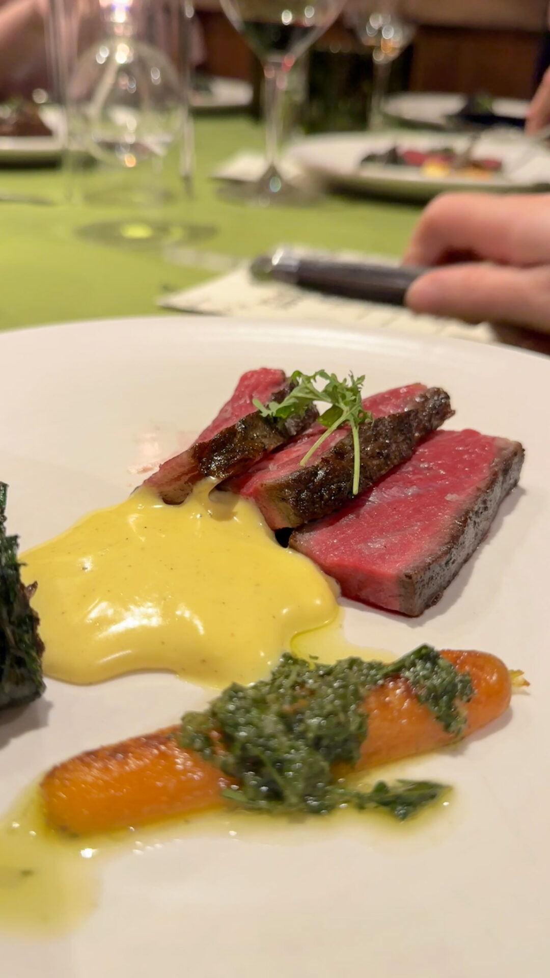 Steak with hollandoise sauce and grilled carroot