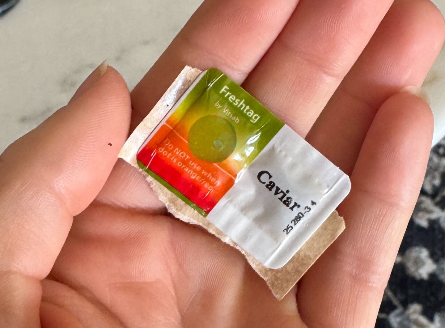 Caviar Fresh Tag in hand