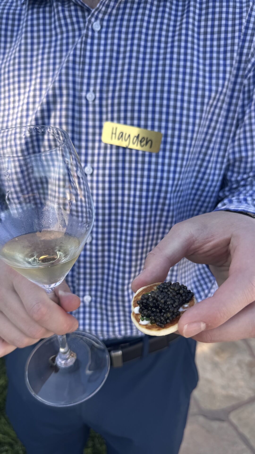 man holding caviar and champagne