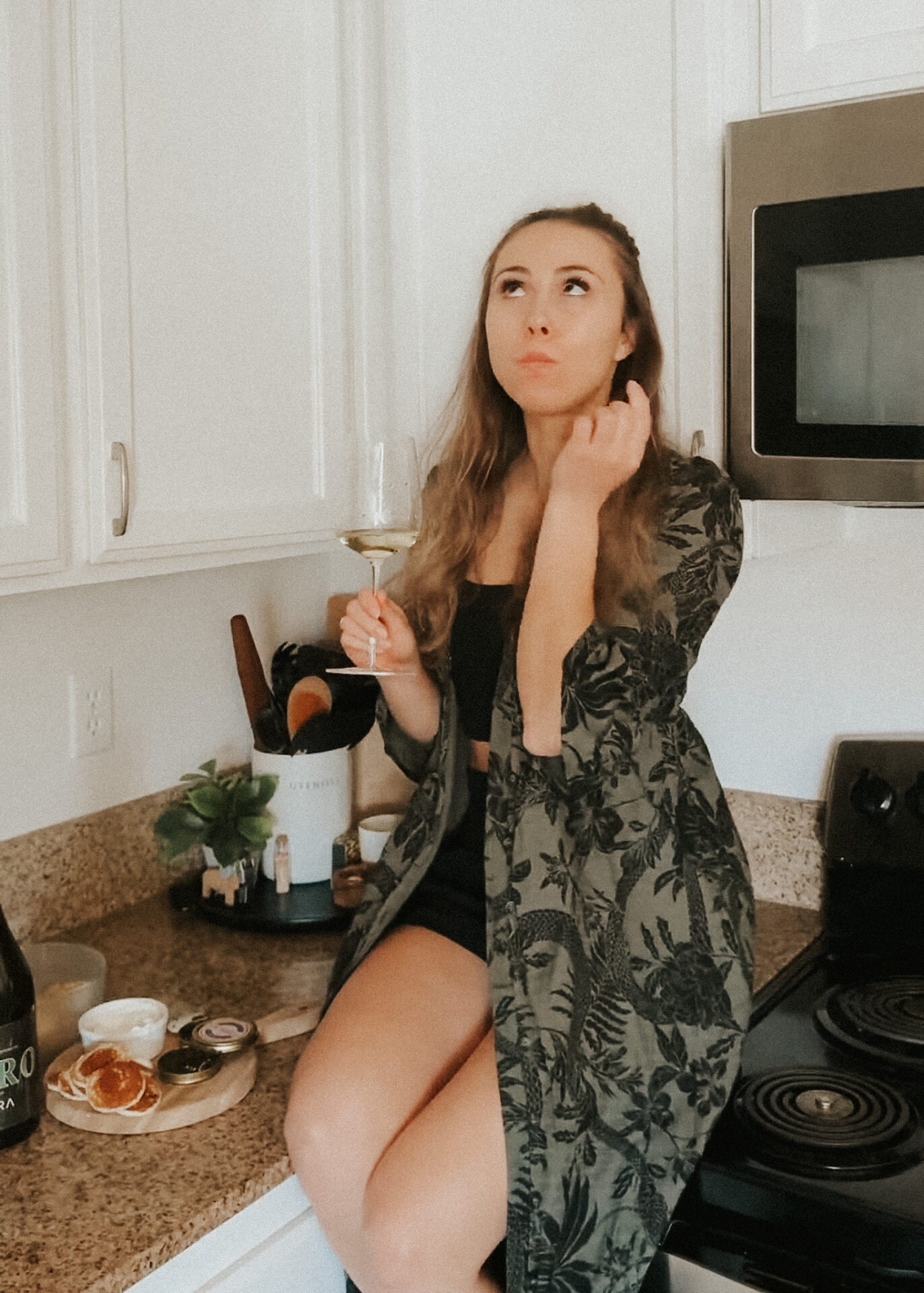 Paige eating caviar on counter top
