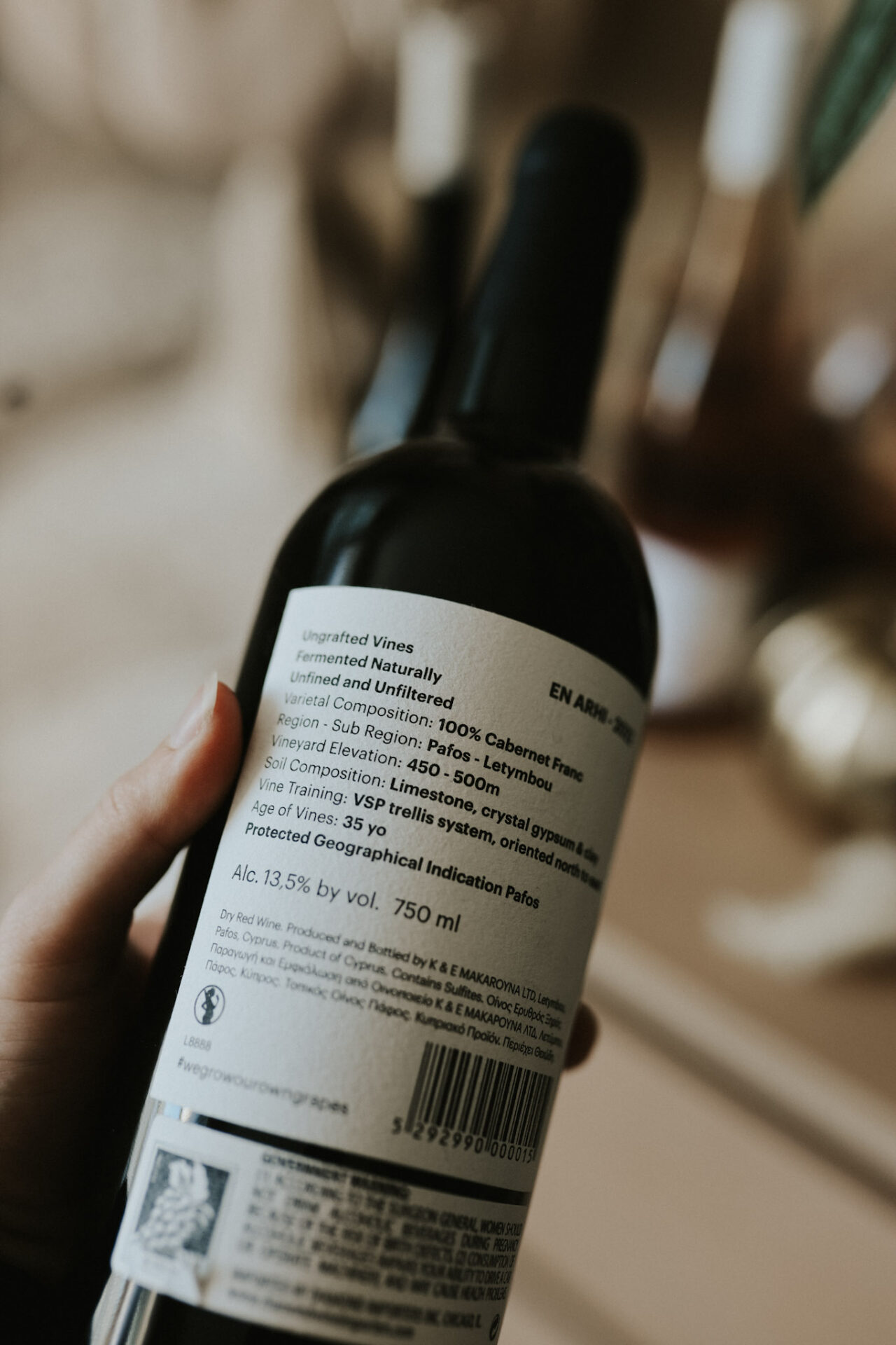 Close-up of a wine bottle label with tasting and vineyard details